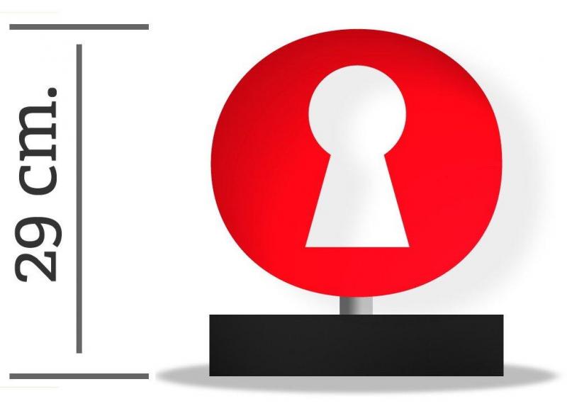 Serrure / Statuette 3 Czerwona okrągła tablica z białą dziurką od klucza na czarnej podstawie; wysokość 29 cm.