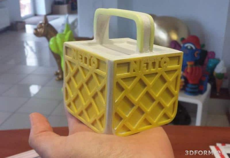 LOGO 3D NETTO 4 Mały model żółtej skrzynki z napisem